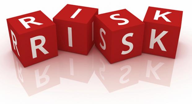 A graphic with red cubes with letters on them. They spell out the word 'risk'.